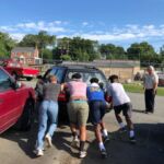 Moving the cars out of the way.